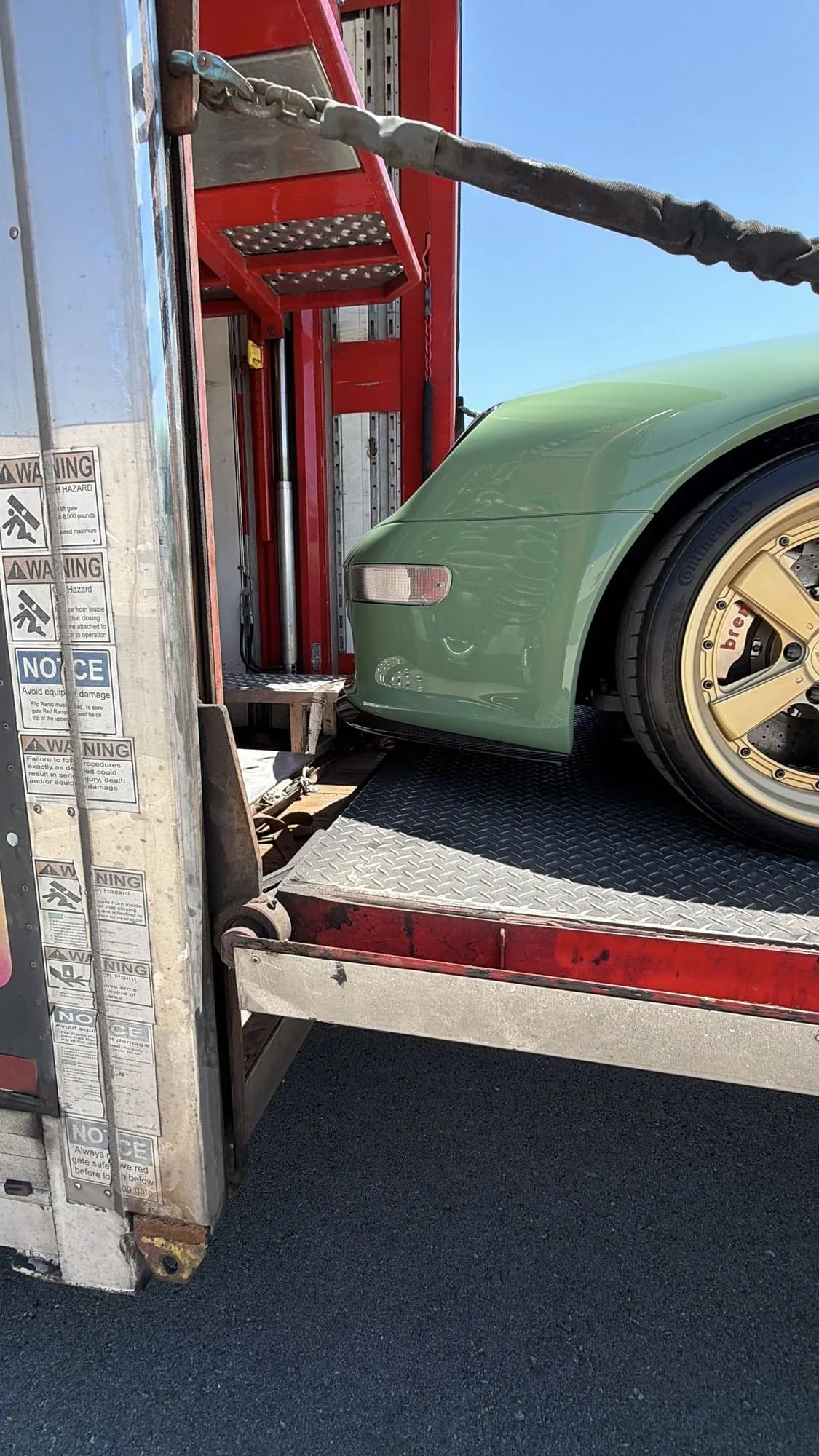 993 nose and gold Brembo wheel on the carrier ramp